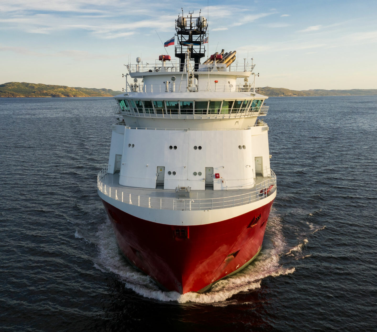 Offshore platform supply vessels in port moored closely together.